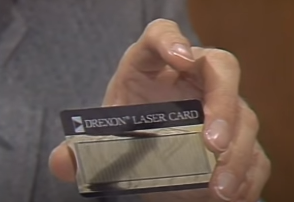 Stewart Cheifet showing a Drexon LaserCard.