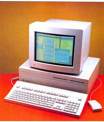 A publicity photo of the Macintosh II with an attached keyboard, mouse, and color CRT monitor. This image was taken from the April 1987 issue of &ldquo;MacUser&rdquo;.