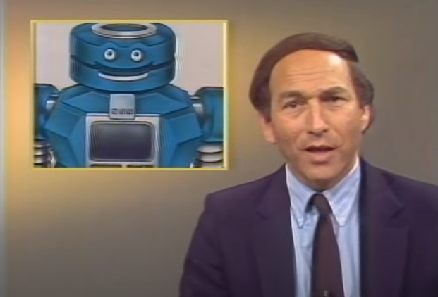 Stewart Cheifet presenting &ldquo;Random  Access&rdquo; with an insert image of a large blue robot with a human-like face.