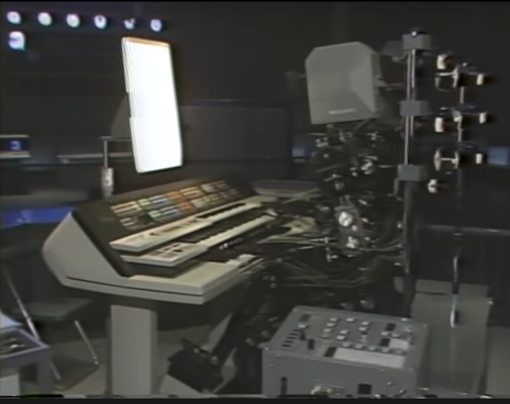 A human-shapred robot plays an electronic synthesizer keyboard.